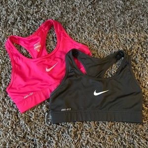 two extra small Nike sports bras black and pink